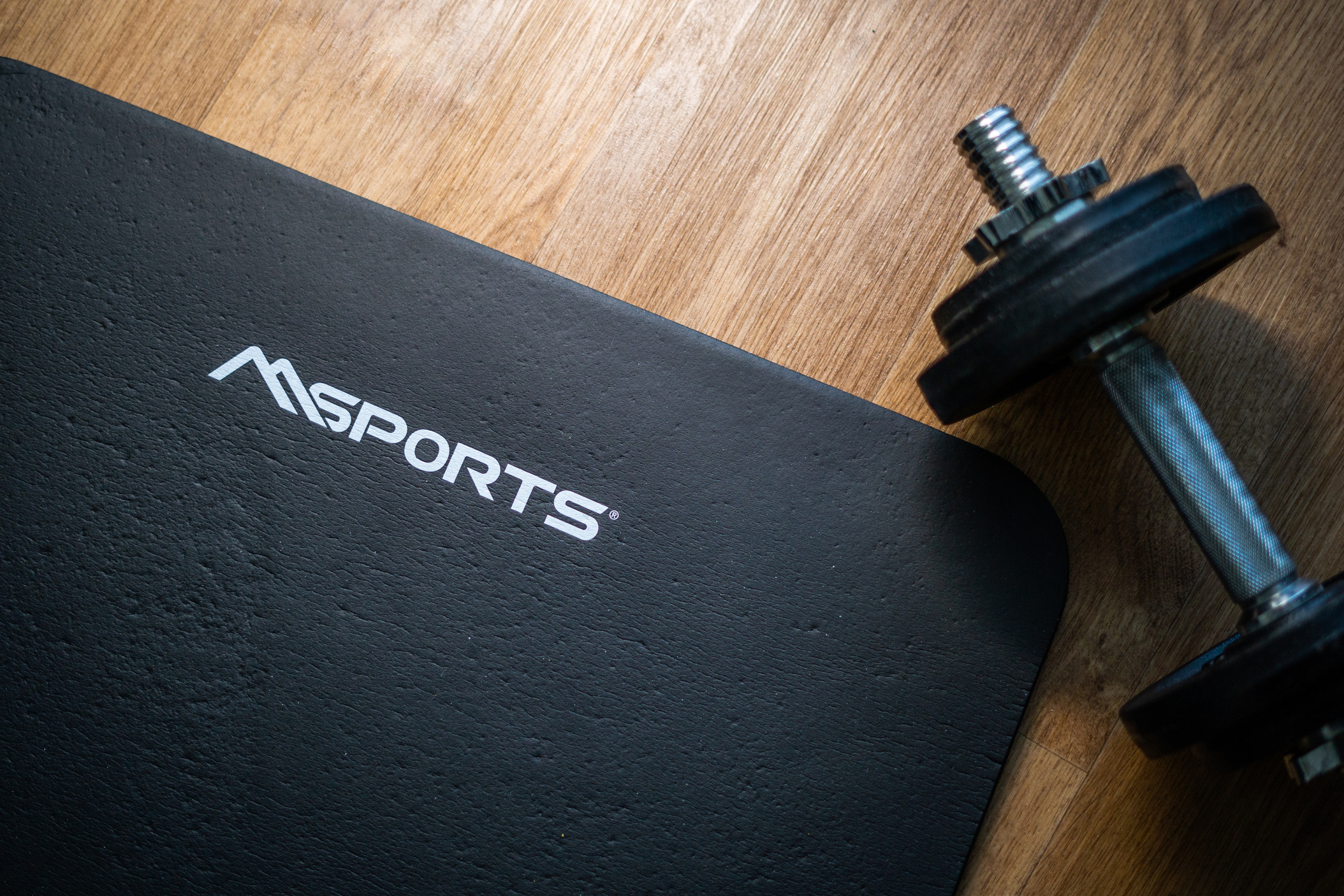 Photo of Dumbbell Near Black Mat